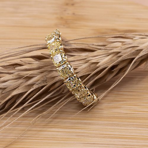 Band ring with fancy yellow cushion diamonds